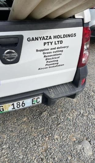 Professional hair stylist meticulously working on a client's hair.