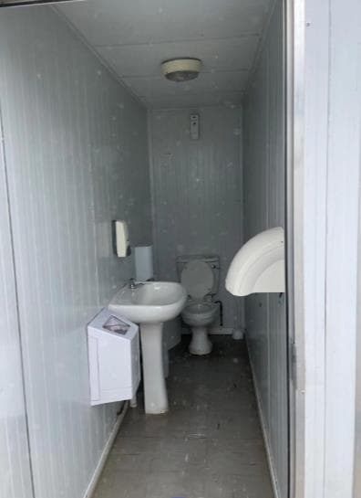 Professional hair stylist meticulously working on a client's hair.